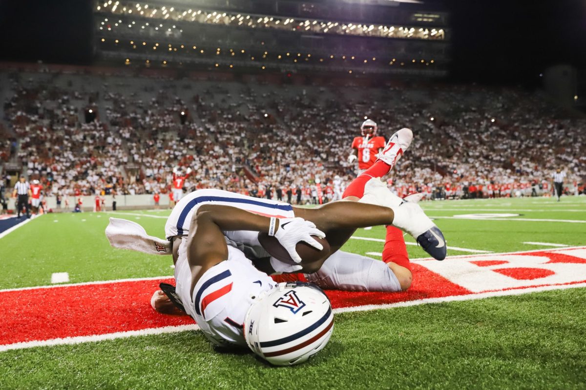 Jacory Croskey-Merritt nearly hauls in a touchdown in the final minutes of the first half against New Mexico on Aug. 31. Arizona and New Mexico totaled for 100 points on the night.