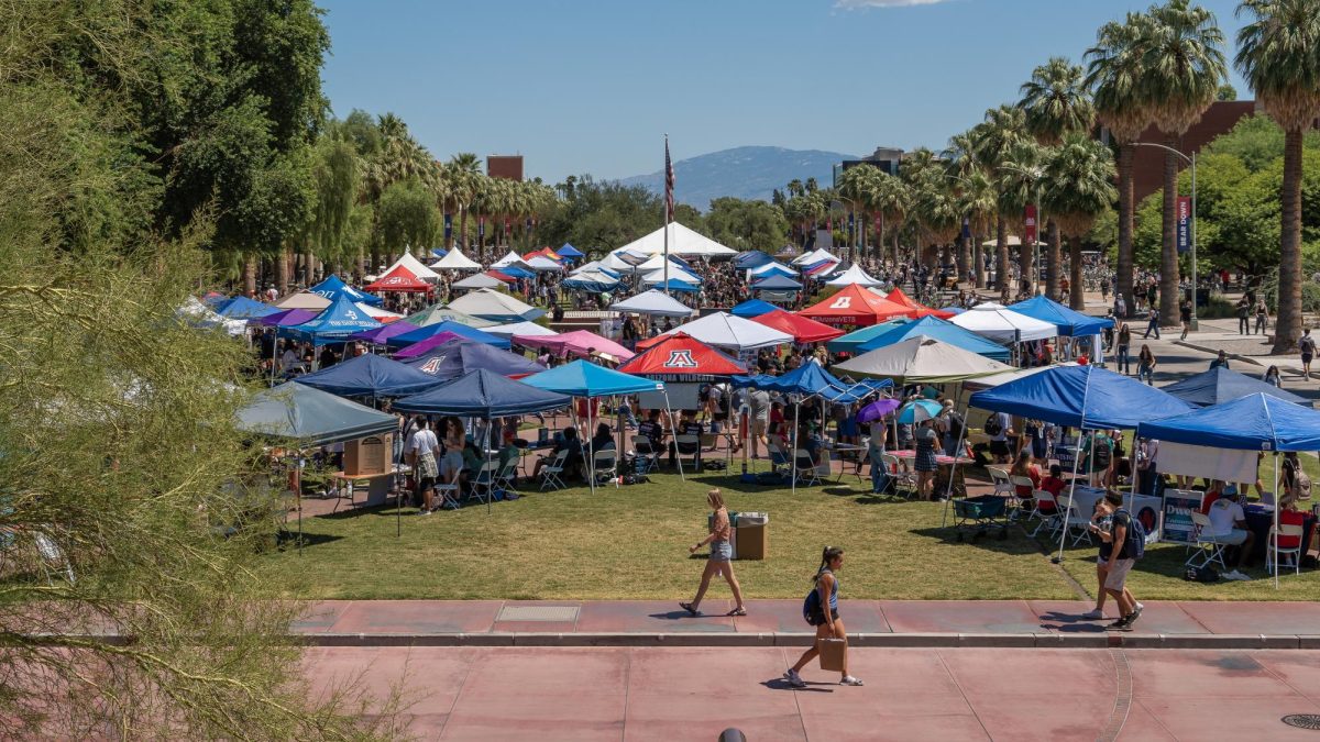 Club attendants on the University of Arizona Mall find themselves busy showing off what their club has to offer to new students on Sept. 5. ASUA is home to more than 500 clubs at UA, the club fair is just one of the events they hold.