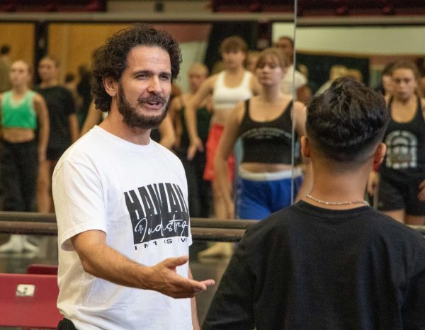 Tyce Diorio greets a student in his intermediate jazz dance class on Sept. 11, 2024 in the Ina E. Gittings building at the University of Arizona.