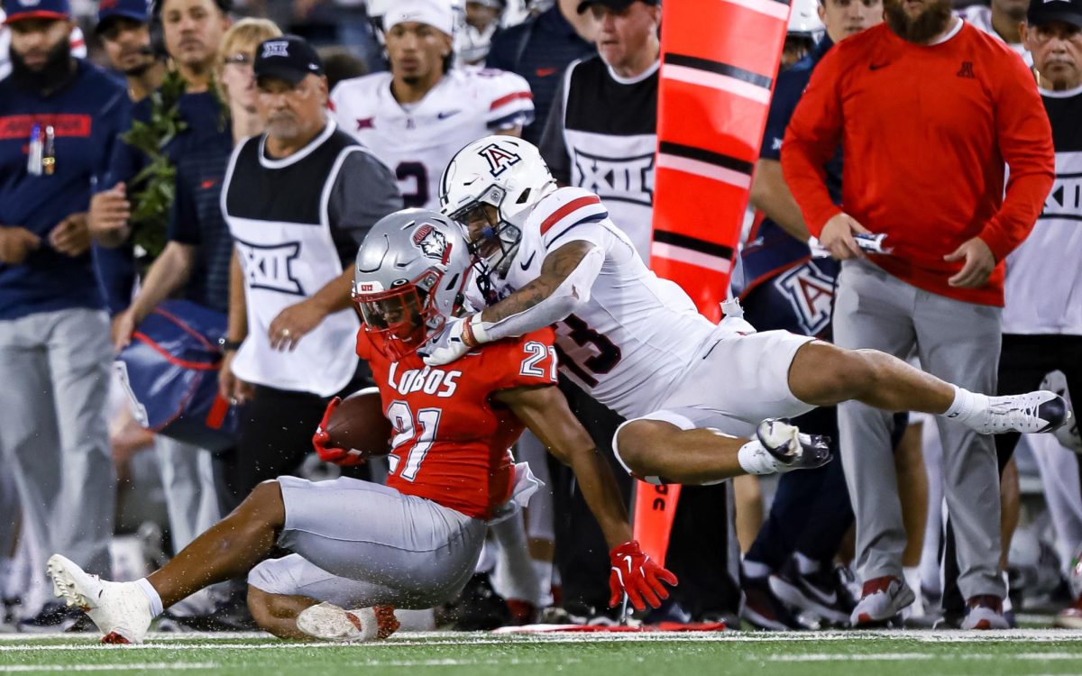 Dalton Johnson brings down a New Mexico player on Aug. 31 at Arizona Stadium. Johnson scored 10 tackles.