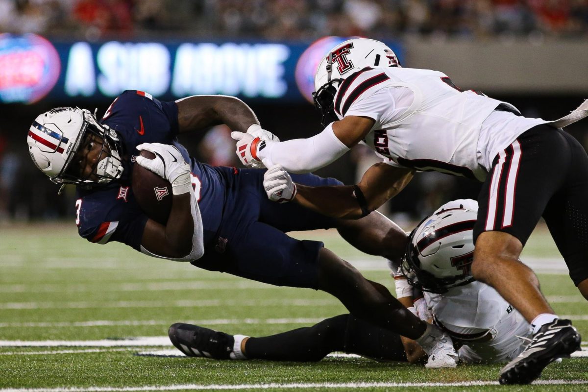 Kedrick Reescano gets tackled late in the fourth quarter against Texas Tech on Oct. 4 at Arizona Stadium. Arizona would not be able to complete the comeback and lost to Texas Tech 22-28.