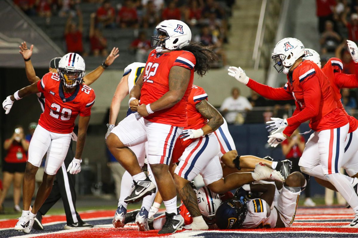 Tyler Manoa and Arizona's defense force a safety against NAU in the fourth quarter at Arizona Stadium on Sept. 7.  Arizona will play its first home Big 12 game against Texas Tech Oct. 5.