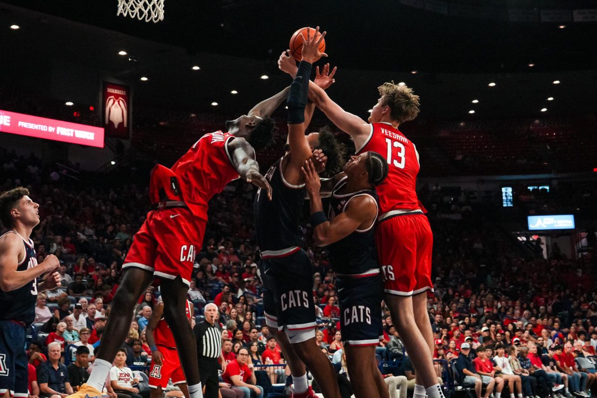 Red team fights for the rebound in McKale Center on Oct. 4. The Red-Blue showcase showed what the season would look like before the Wildcats enter the Big 12.