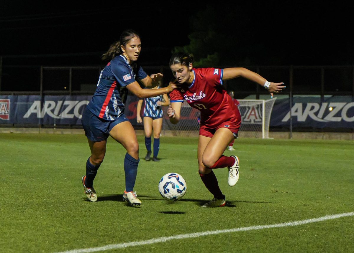 University of Arizona soccer player Sami Baytosh battles for possession of the ball at Murphy Field on Oct. 17. Arizona lost to Kansas with a final score of 0-4.