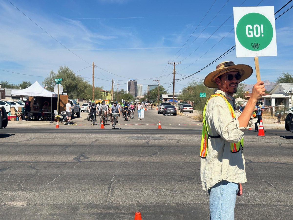 Traffic guards manage crossings for riders at 22nd Street during Cyclovia on Sunday, October 27. Tucson has held this cycling event in the fall and spring since 2010. 