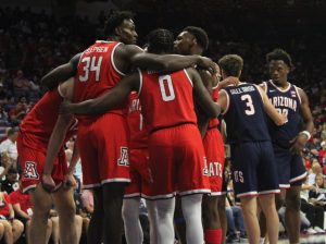 Members of the Red team huddle together during the Arizona men's basketball annual Red-Blue Scrimmage on Oct. 4. The Wildcat roster includes some experienced returners and talented freshmen. 