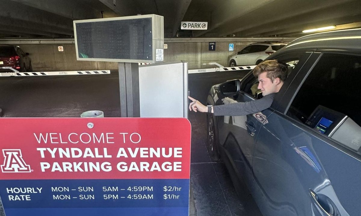 Matthew Mackleit enteris the Tyndall parking garage before class. Tyndall is just one of the garages included in the University of Arizona's new weekend parking policy. 