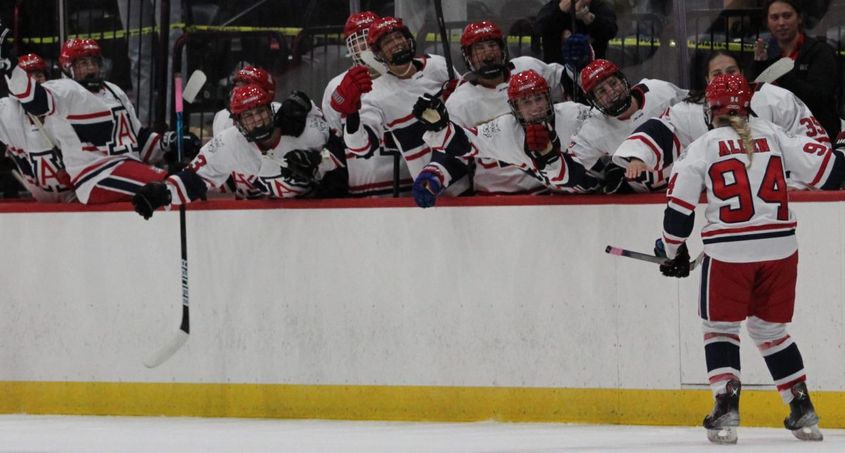 Defense Savannah Allen, 94, celebrates with teammates on Sept. 26 at the Tucson Convention Center. Allen scored a goal in the first period.