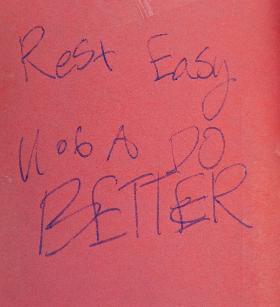 A note reading "Rest Easy. U of A DO BETTER" sits at Minhaj Jamshidi's memorial at the sand volleyball courts on Sept. 24. Community members have called for stronger security measures on the University of Arizona campus after several shootings.