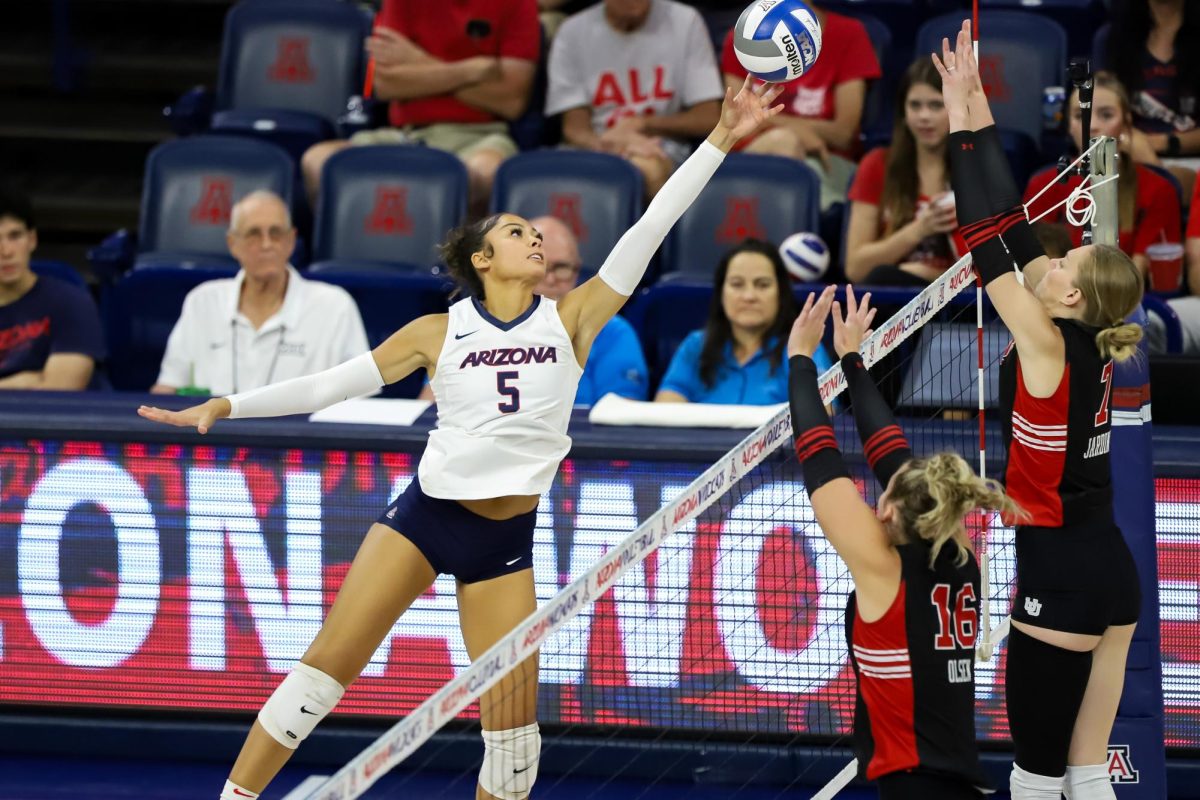 Jordan Wilson reaches for the ball against Utah on Oct. 4 in McKale Center. Wilson was previously at USC before transferring in 2023.