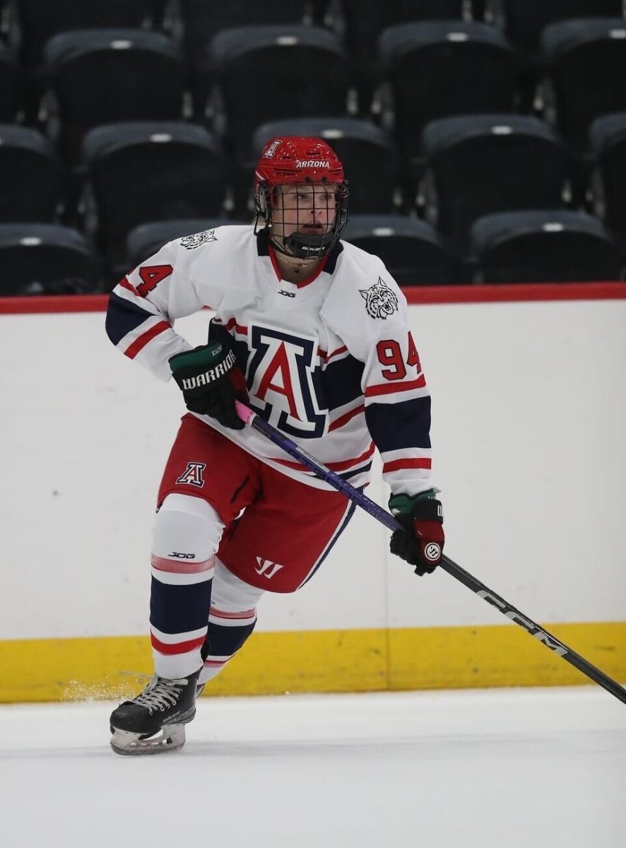 Savannah Allen plays hockey on the ice rink inside the Tucson Convention Center. Allen is a member of the University of Arizona's first women's hockey team. 