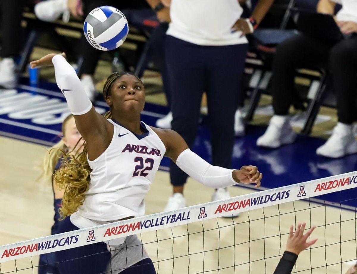 Middle Blocker Journey Tucker making a play against Utah on Oct. 4 in McKale Center. Tucker is a local player from Buckeye, Ariz.