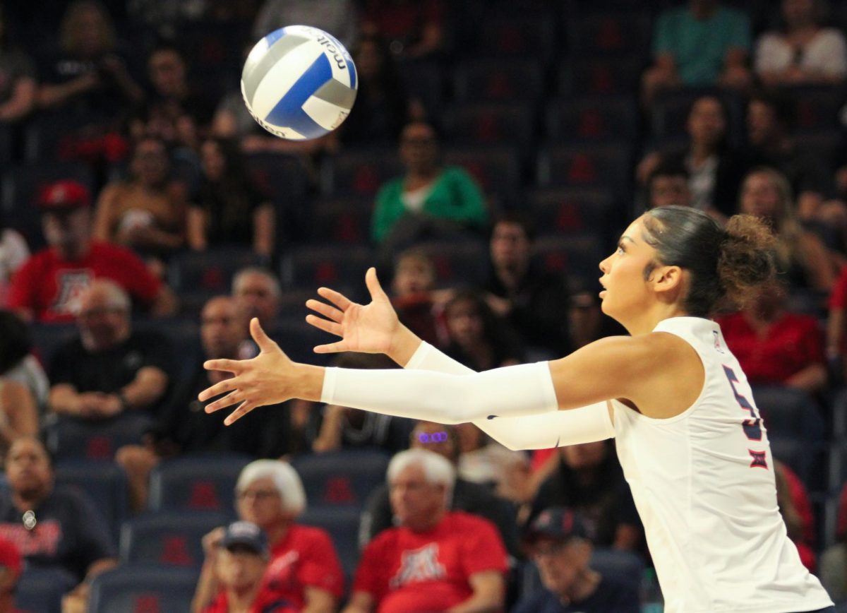 Jordan Wilson, 5, goes for the ball in the first set of the game against Brigham Young University on Oct. 2 in McKale Center. Arizona took the lead of the game, winning the first set.