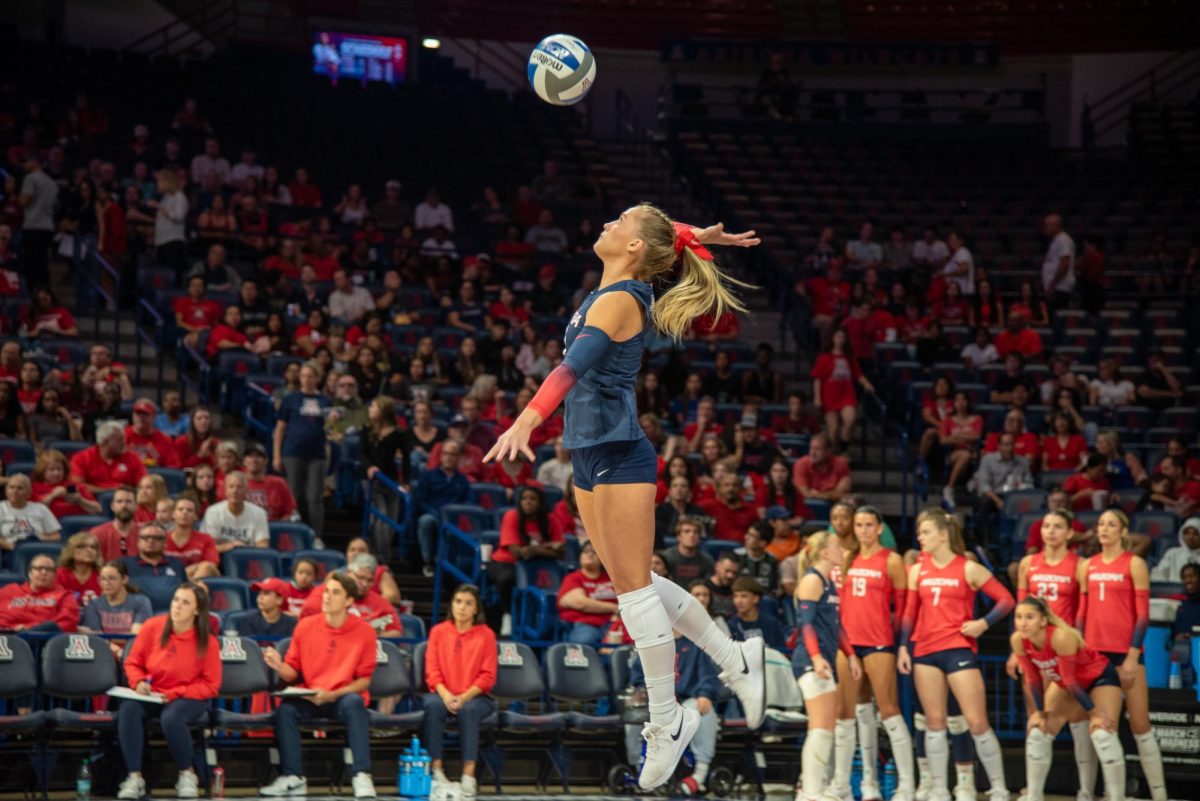 A University of Arizona volleyball player hits the ball on Oct. 24 against Arizona State University in McKale Center. The Wildcats lost 3-1.