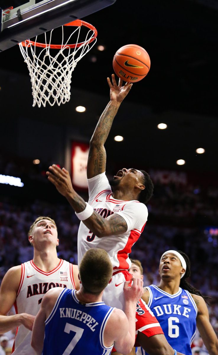 University of Arizona mens basketball player KJ Lewis rises for a tough shot against Duke on Nov. 22 in McKale Center. Lewis shot the most free throws of any Wildcat with 3.