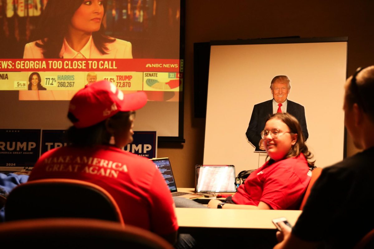 Members of UA College Republicans watch the NBC live election report in the Mesquite Room on Nov. 5. Polls closed at 7 p.m. in Arizona.