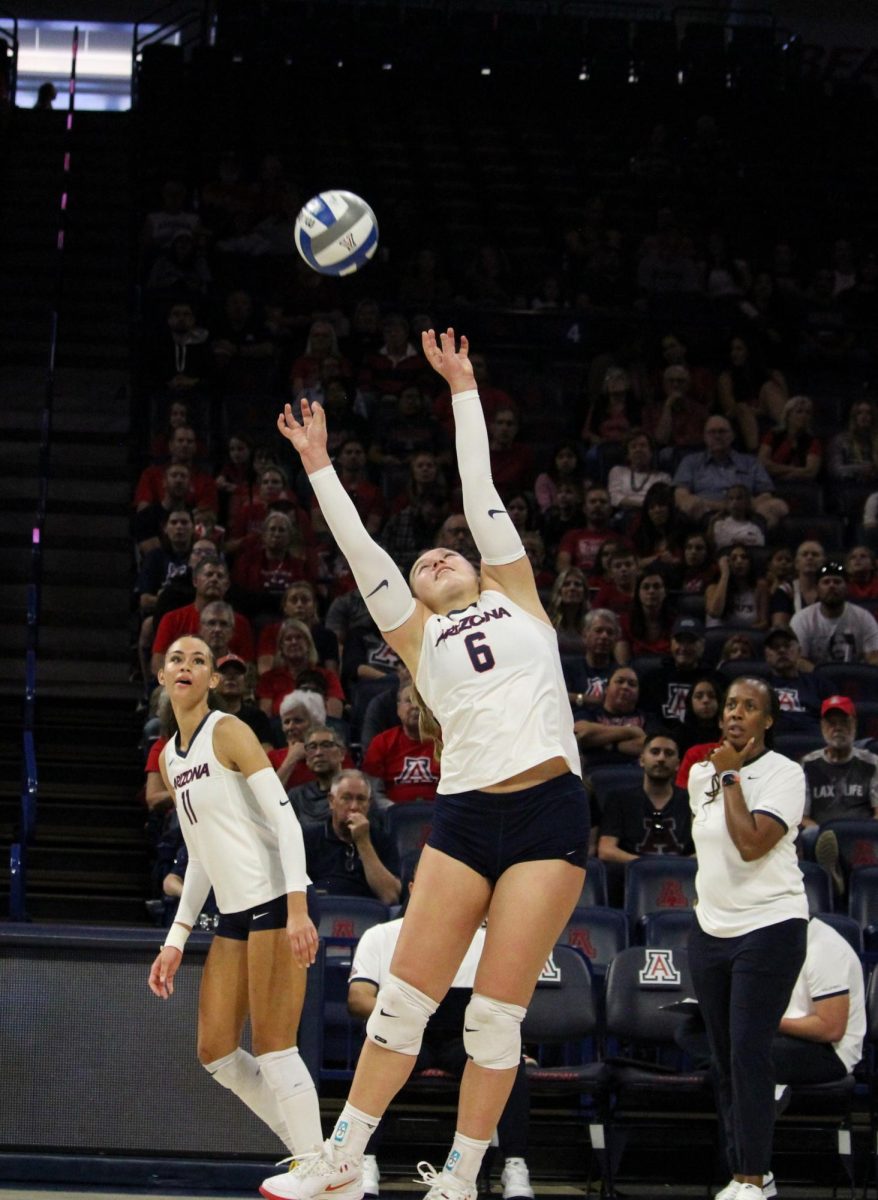 University of Arizona volleyball player Avery Scoggins goes to hit the ball in McKale Center on Nov. 23. The Wildcat's won the first set, lost the second and won the third and fourth, beating Iowa State University 3-1. 