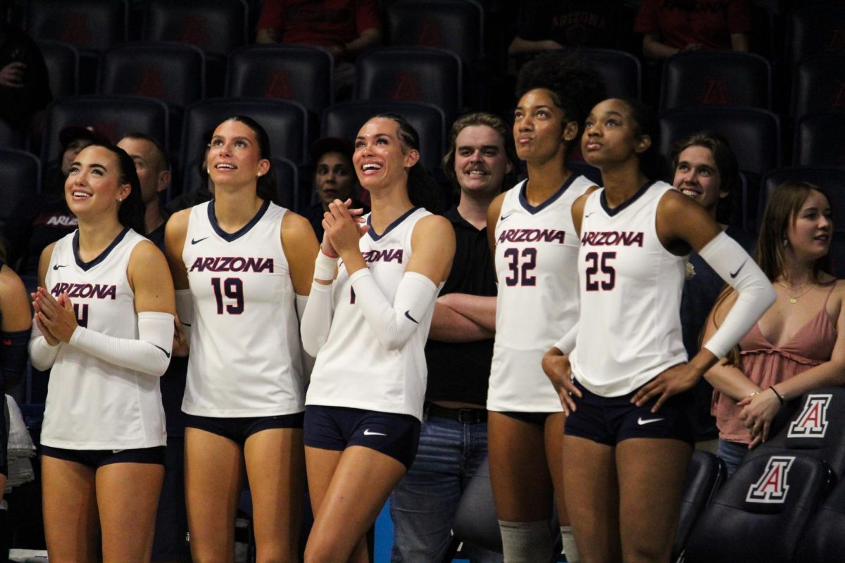 The University of Arizona's volleyball seniors in McKale Center on Nov. 23. The seniors watch a video made for them before the game.