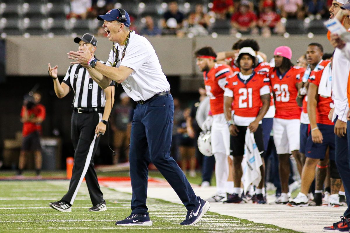 Arizona head coach Brent Brennan gets fired up in the fourth quarter against West Virginia on Oct. 26 at Arizona Stadium.  Brennan is in his first year of coaching at Arizona.