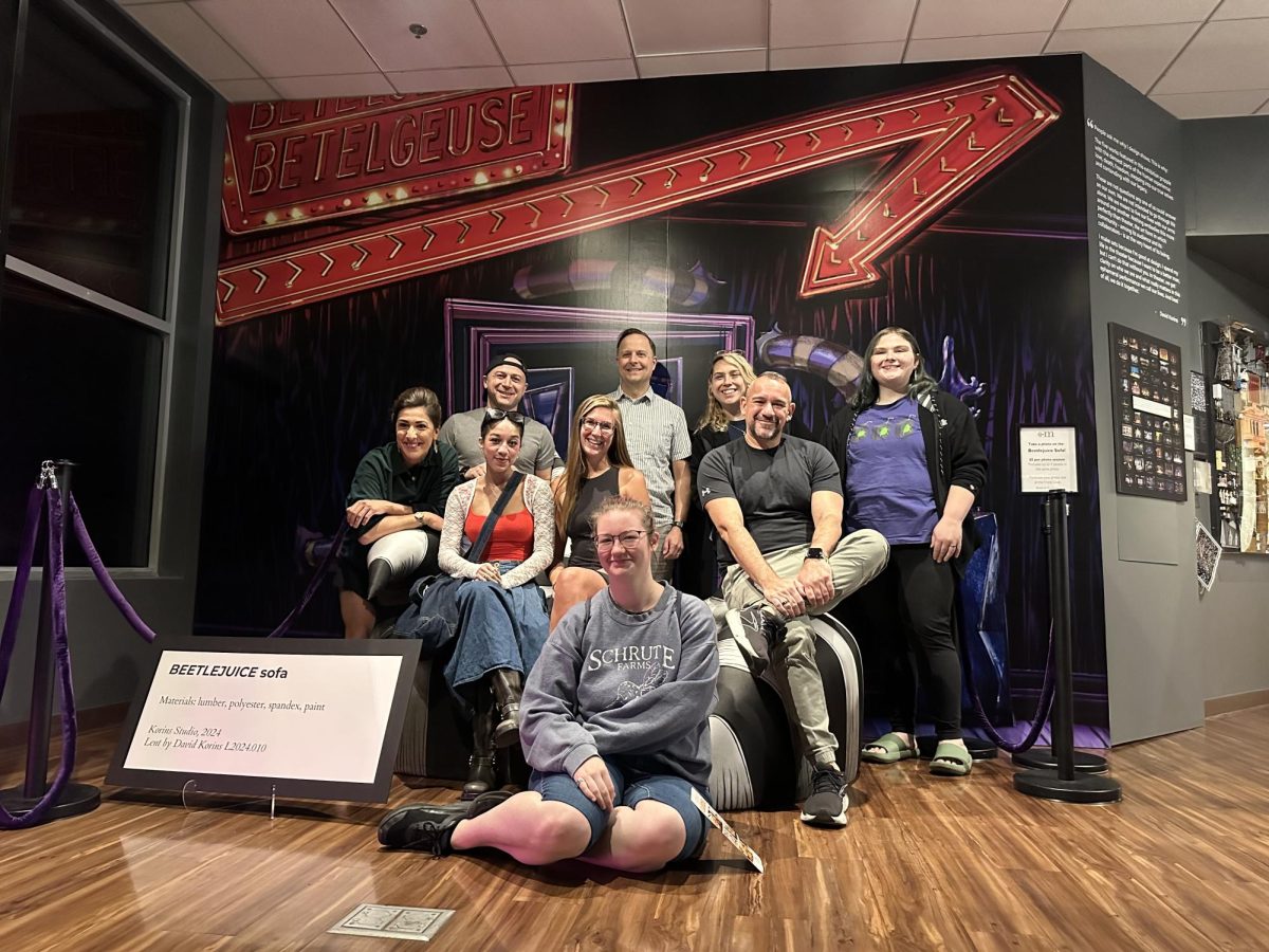 Cast members from Beetlejuice the Musical pose for a group photo at the Mini Time Machine Museum of Miniatures on Dec. 4. Beetlejuice the Musical will be at Centennial Hall Dec. 3 through Dec. 8.