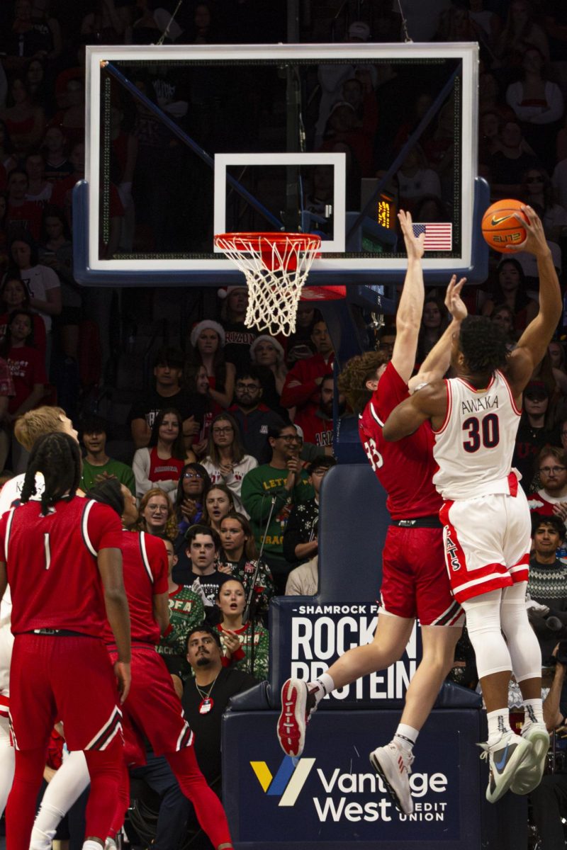 Arizona Men's Basketball player Tobe Awaka tries to score against Brock Felder of Southern Utah on Dec. 7 in McKale. Awaka scored 19 points during the game.