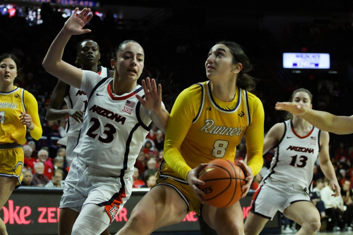 University of Arizona womens basketball player Paulina Paris plays defense while a California State University, Bakersfield womens basketball player handles the ball on Dec. 10 in McKale Center. Paris was one of three Wildcat's to score double figures, putting up 11 points. 