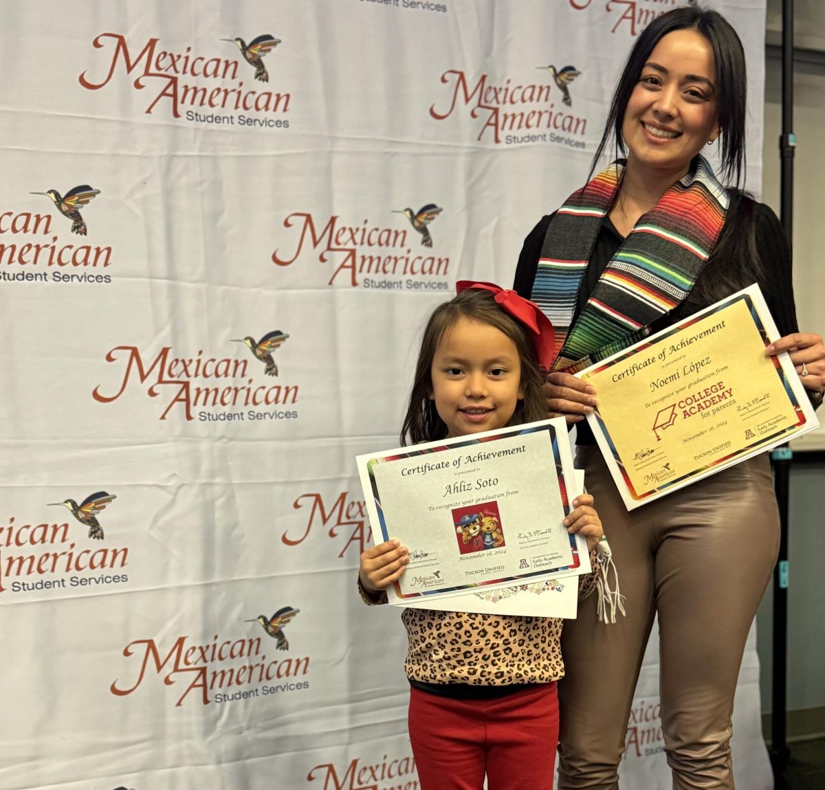 Ahliz Soto and Noemi Lopez proudly hold their certificates of achievement from Mexican American Student Services Department’s College Academy for Parents. 