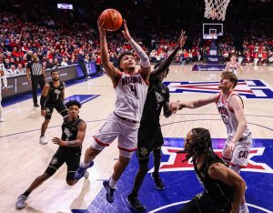 Fifth-year forward Trey Townsend drives towards the hoop as the Arizona men's basketball team faces the University of Central Florida in McKale Center on Saturday, Jan. 11. the WIldcats defeated UCF 88-80. (Courtesy Mike Christy, Arizona Athletics)