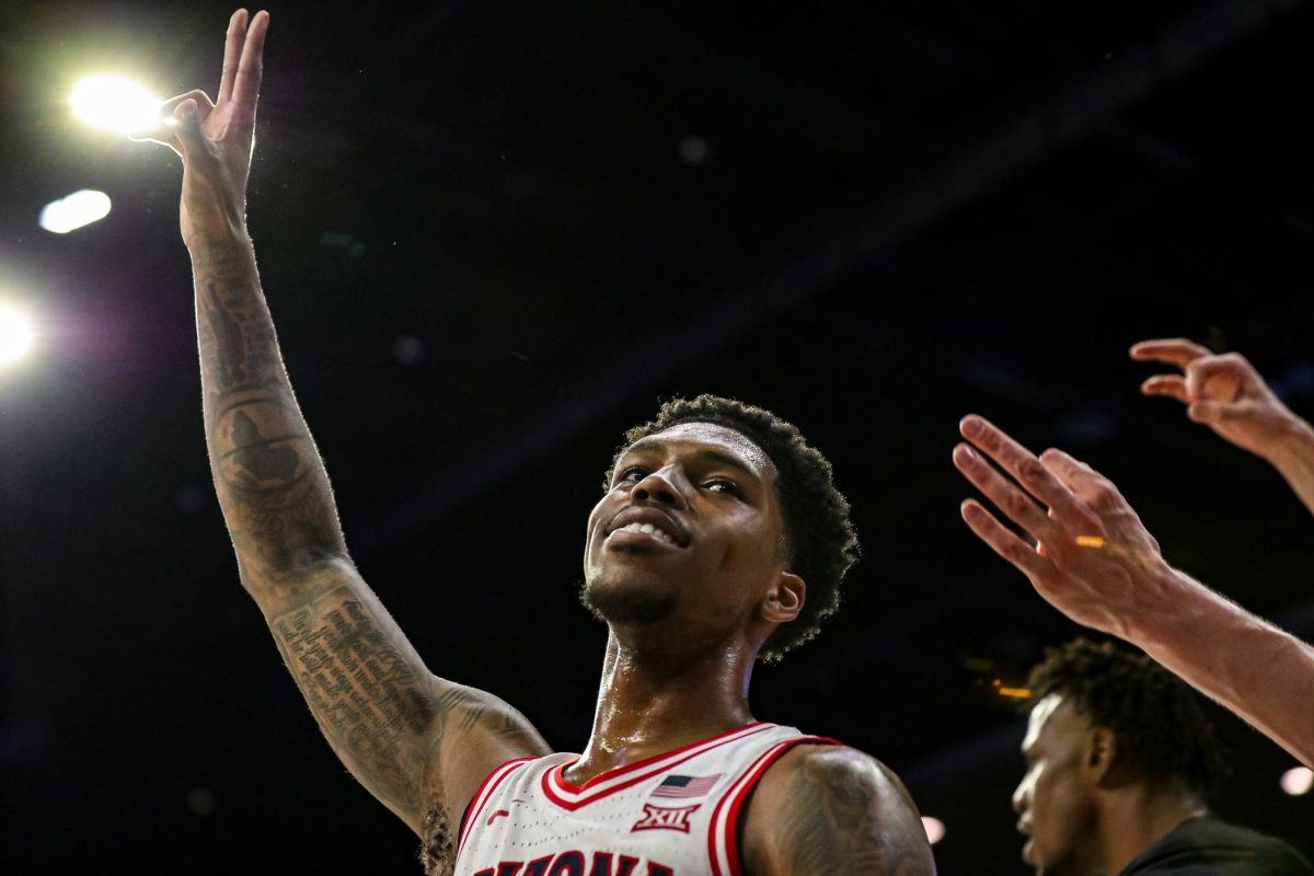 Caleb Love celebrates a made basket against the University of Utah on Wednesday, Feb. 26 in McKale Center