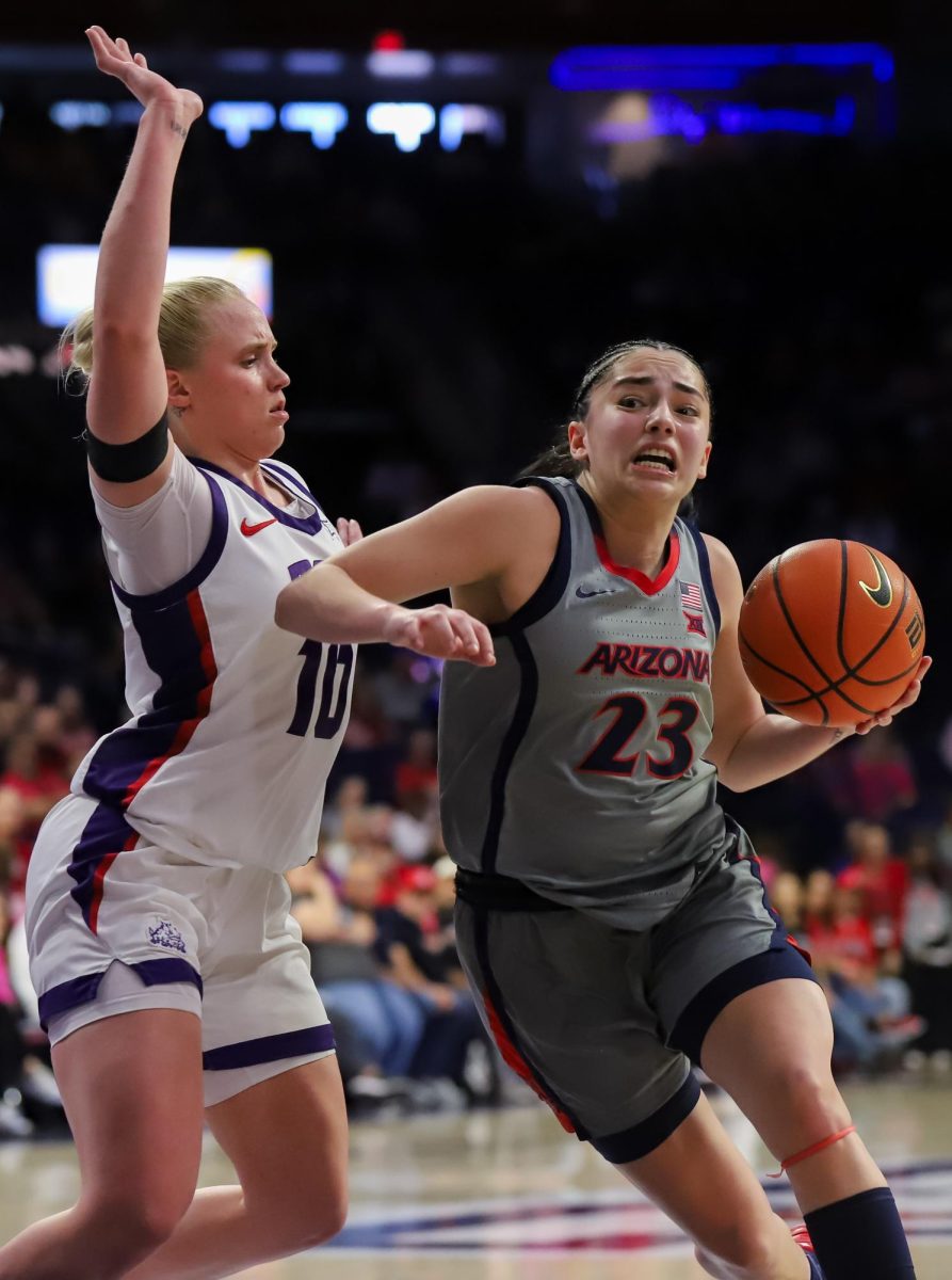 Paulina Paris drives in on TCU guard Hailey Van Lith in McKale Center on Feb. 16. Paris played 35 minutes despite sickness.