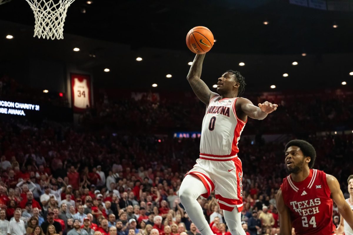 Jaden Bradley of the Arizona Wildcats jumps to make a dunk against the Texas Tech Red Raiders during their game on Feb. 8 in McKale Center. Bradley scored a total of 16 points during the game.
