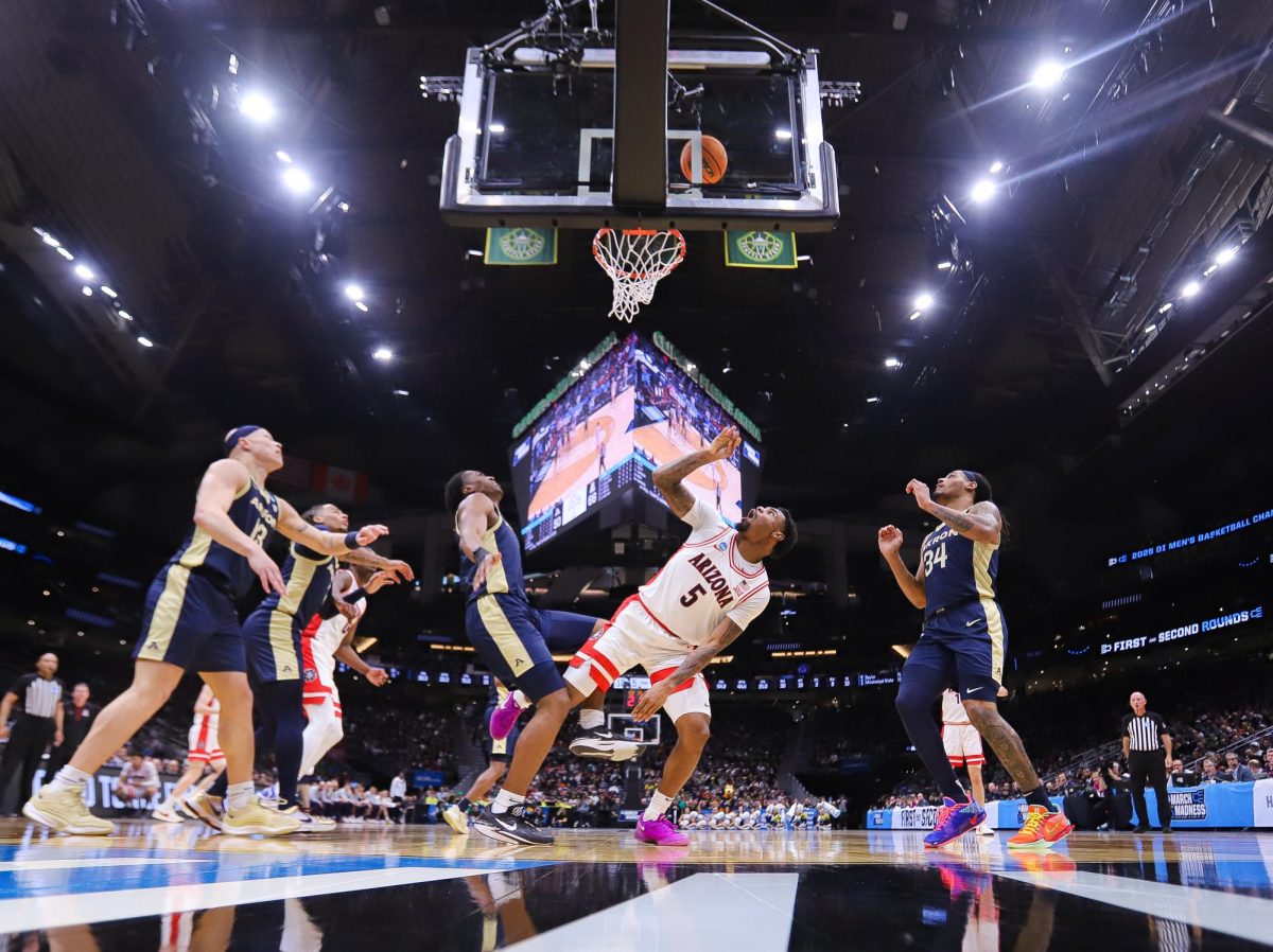 KJ Lewis watches his layup rattle around the rim in Arizona's first round matchup against University of Akron on March 21 in Seattle, Washington. in Climate Pledge Arena.  Lewis was the only player on the team to record points, assists, rebounds, a steal and a block.