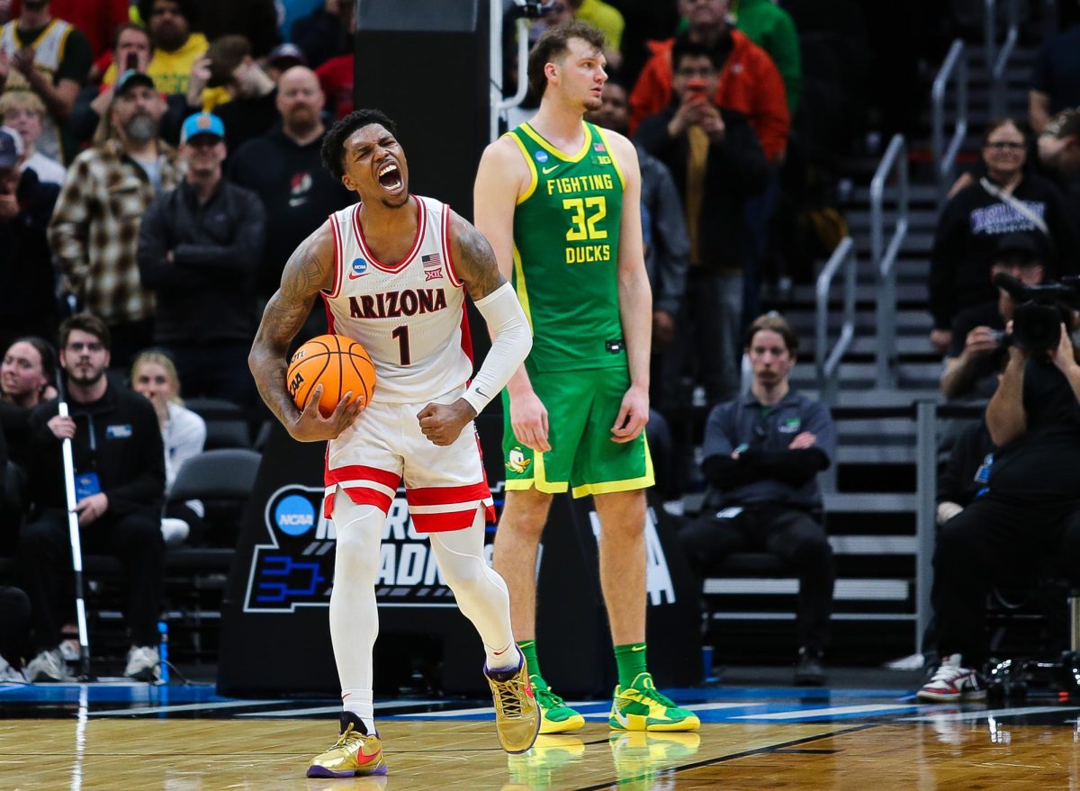 Caleb Love celebrates the imminent Arizona win over the University of Oregon in the final seconds of the second half on March 23 in Seattle, Washington in Climate Pledge Arena.  Love finished the game with 29 points as well as 5-7 from 3.