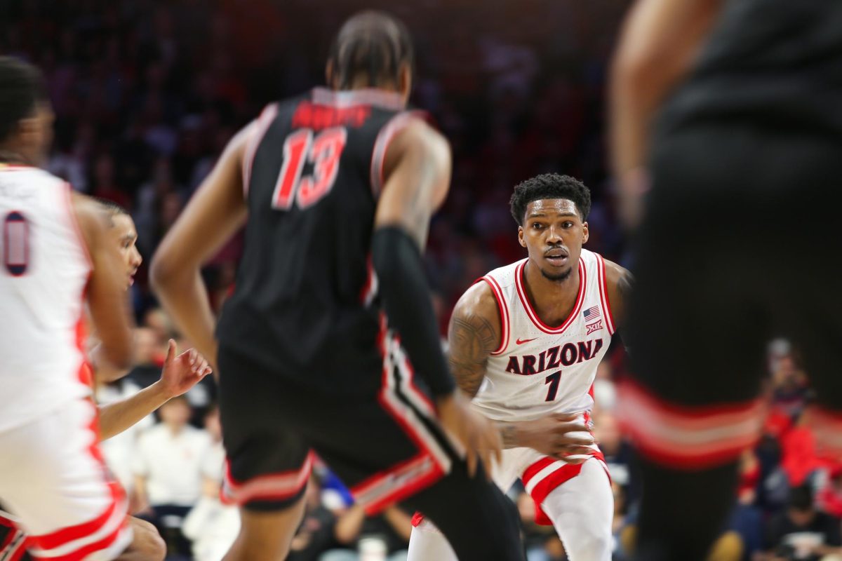 Caleb Love looks for a pass against Houston on Feb. 15 in McKale Center.  Love led the team with seven assists.