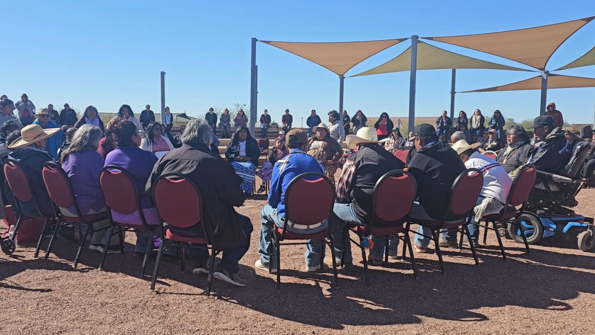 Tribal members sit in a circle, chanting their original songs at the beat of wood Maracas on drums to celebrate the opening of the O’odham Ňi’okĭ Ki:, a hopeful dream for the survival of their language.  