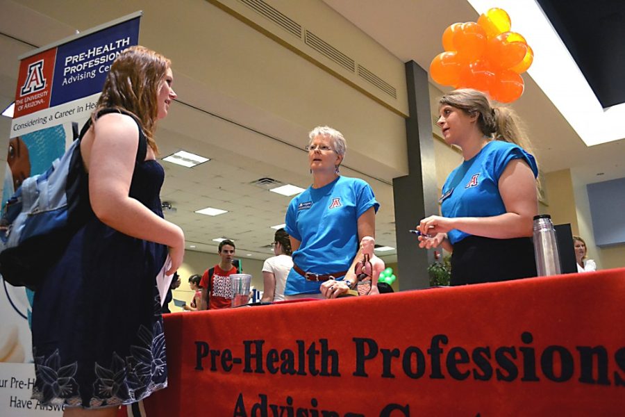 Zachary Vito / Arizona Daily Wildcat

Freshman Madison Bardsley visits the meet your major fair in the student union grand ballroom.  From left, advisors Stephanie Rollins and Mara Vahratian provide Bardsley with more information about the UAs pre-nursing major.  