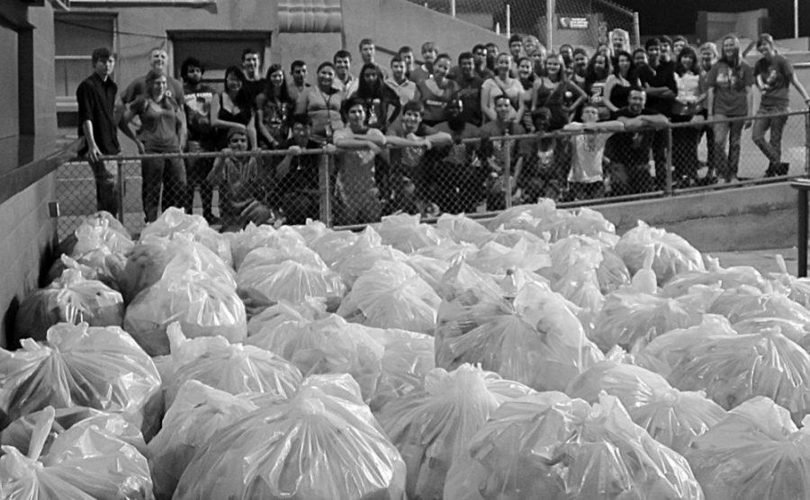 Clubs team up to remove recyclable refuse leftover from football games