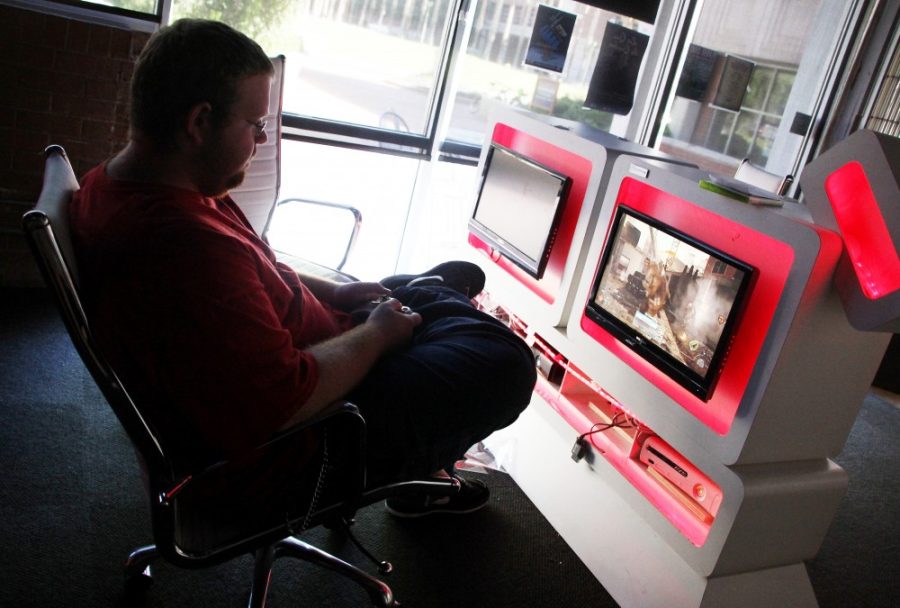 Kevin Brost / Arizona Daily Wildcat

Microbiology Sophomore Tyler Hoffman plays an Xbox 360 in the Park Student Union gaming center, Code, on October 16, 2011.