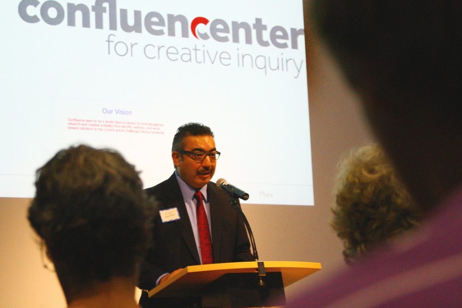 Gordon Bates / Arizona Daily Wildcat
Javier Duran, Associate Professor of Spanish and Border Studies, speaks at The Helen S. Schaefer Poetry Center to welcome the new Confluence Center for Creative Learning on Monday, October 24.