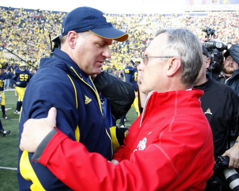 Ohio State head coach Jim Tressel greets Michigan head coach Rich Rodriguez after the Buckeyes' 21-10 victory in Ann Arbor, Michigan, on Saturday, November 21, 2009. (Julian H. Gonzalez/Detroit Free Press/MCT)