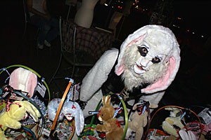 A person in a bunny suit peddles cryptic Easter baskets.