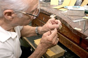 Carlos Diaz shows how he makes the many different kinds of rings he sells at his store. Aside from rings, he makes a variety of jewelry and almost anything related to silver and gold.