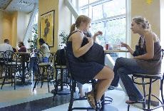 Caroline Wright, left, a political science major, and Jaclyn Staub, a biology freshman, sat down to talk over their drinks at Canyon Cafe at the Student Union Memorial Center Thursday. Wright said, Starbucks has a long line every single day and hour.