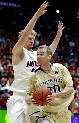 Washington guard Ryan Appleby tries to get around Arizona forward Chase Budinger in the Wildcats 84-69 win in McKale Center on Jan. 26. Appleby has been very hot shooting 3-pointers lately, but his long-ball game tends to be hit or miss.
