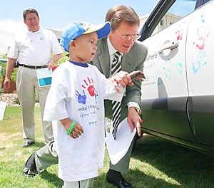 Children battling cancer at University Medical Center left their mark on an SUV yesterday during a ceremony in which $50,000 was donated for pediatric cancer research. 