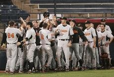 Members of the No. 12 Oklahoma State baseball team celebrate after taking an early lead during a 10-4 OSU win against Arizona Tuesday night at Sancet Stadium. The Wildcats left 10 runners on base and committed two errors in the loss.