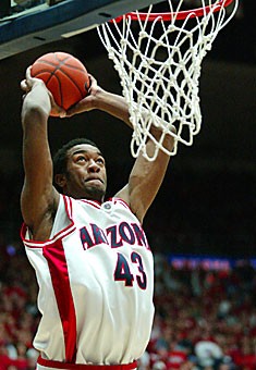 UA forward Jordan Hill dunks during the first half of Arizonas 92-64 loss to North Carolina Saturday in McKale Center. Hill recorded the first double-double of his career with 13 points and 10 rebounds against the Tar Heels.