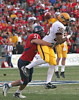 Linebacker Spencer Larson takes down ASU running back Shaun DeWitty in a 28-14 loss at Arizona Stadium on Nov. 25, 2006. Larson led the team with 89 tackles last season, coupled with an interception and three recovered fumbles.