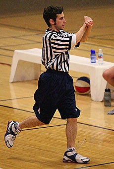Arizona Daily Wildcat assistant sports editor Michael Schwartz makes a foul call during his stint as a ref in late February.