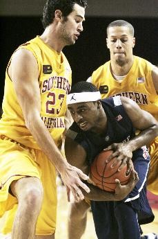 UA guard Nic Wise gets cornered by USCs Keith Wilkinson (left) and Daniel Hackett (back) during a 65-64 Trojan win on Jan. 17 in Los Angeles. Despite the loss, Arizona has admittedly played with more intensity since that game.